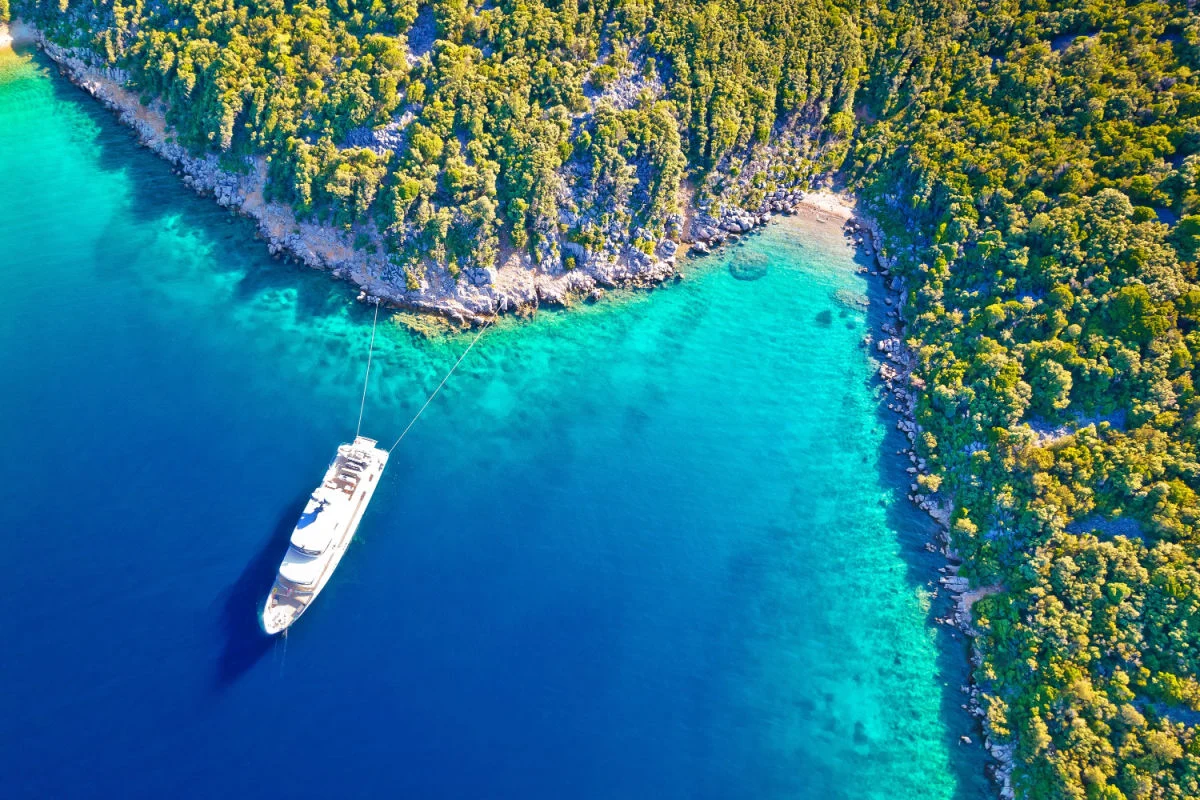 Aerial view of yacht on vibrant blue waters of Losinj, Croatia